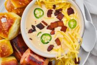 Creamy Beer Cheese Soup Recipe with Bacon and Pretzel Croutons