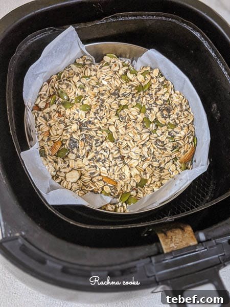 Crunchy Air Fryer Granola Recipe for Perfect Homemade Clusters 9 granola in air fryer basket for air frying