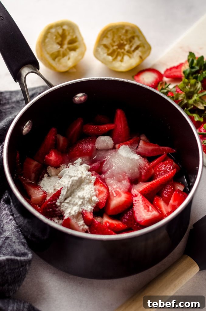 Decadent Strawberry Swiss Roll Recipe with Cream Filling 14 ingredients to make strawberry compote in a saucepan