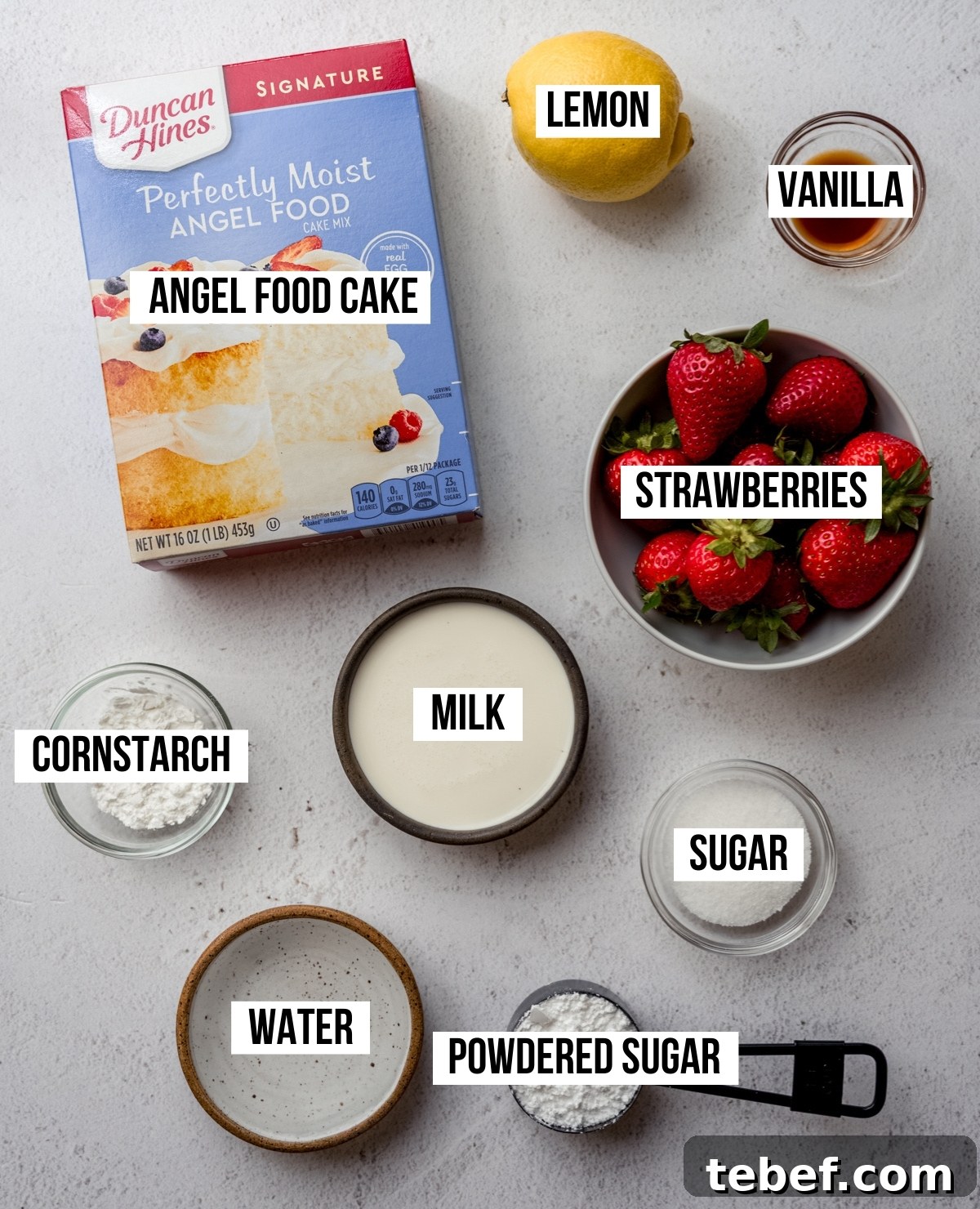 Decadent Strawberry Swiss Roll Recipe with Cream Filling 5 Aerial photo of ingredients to make a strawberry Swiss roll cake.