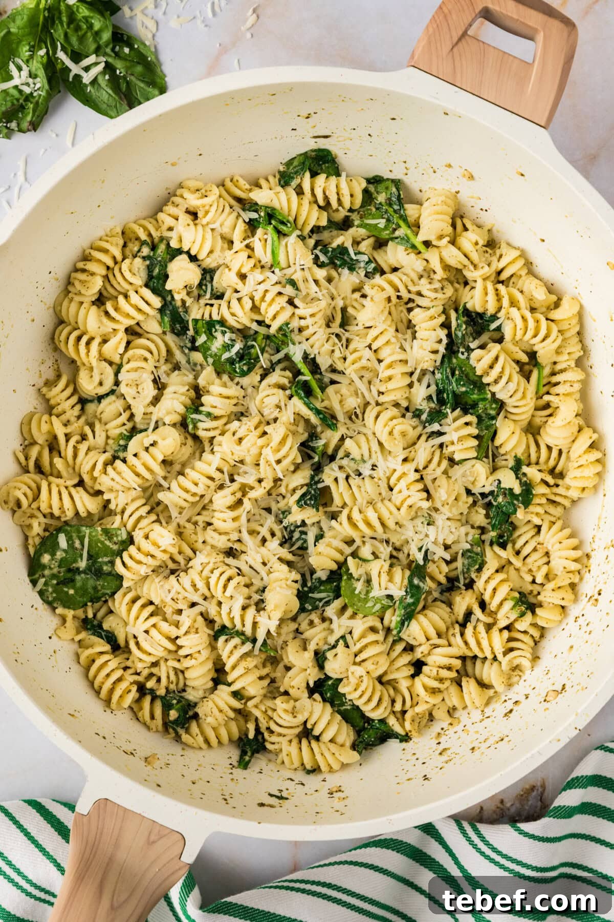 Creamy Basil Pesto Pasta with Parmesan and Pine Nuts 9 Close up photo of a skillet of Pesto Pasta