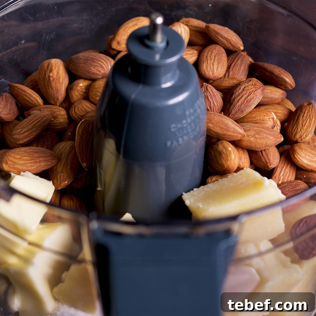 The bowl of a food processor that contains freshly made frangipane.
