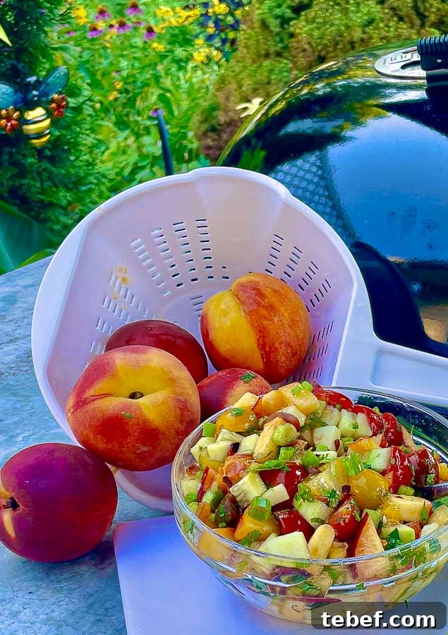 glass bowl of summer peach and tomato chop salad