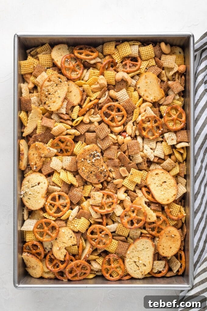 Everything Bagel Chex Mix Recipe — Crunchy Savory Snack Mix 4 Cake pan filled with homemade Chex mix.