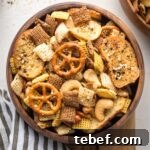 Everything Bagel Chex Mix Recipe — Crunchy Savory Snack Mix 5 Small wooden snack bowl filled with everything bagel Chex mix.