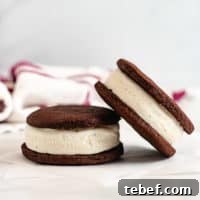 Two ice cream sandwiches next to each other.