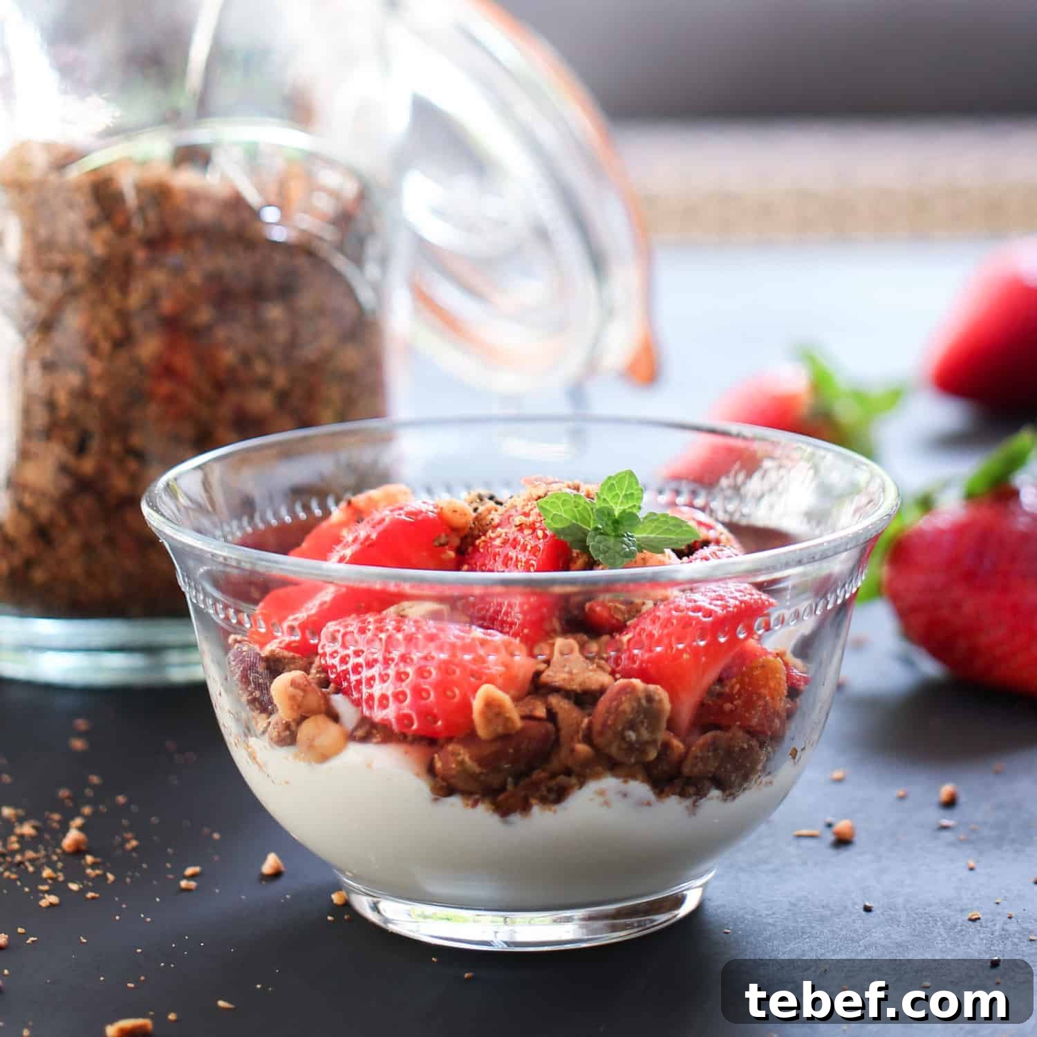 Crispy Roasted Buckwheat & Toasted Coconut Granola Recipe 5 Photo showing a bowl of Roasted Buckwheat and Coconut Granola with coconut yoghurt and fresh berries for a healthy plant-based breakfast.