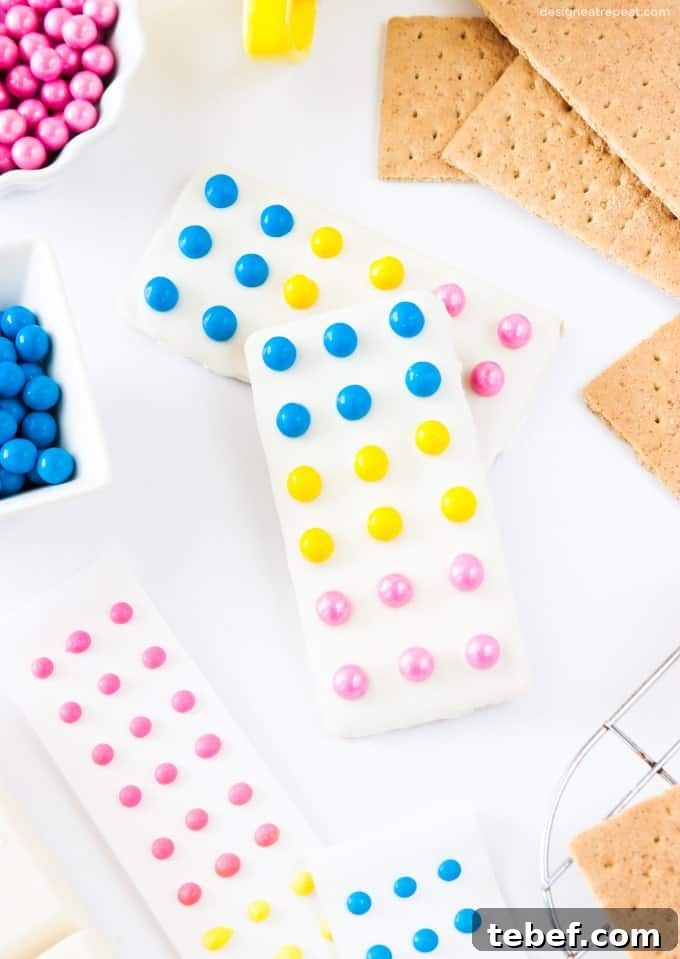 Candy Button Graham Cracker Bars Recipe — No-Bake Party Treat 4 Turn graham crackers into candy button bars with almond bark & Sixlets!