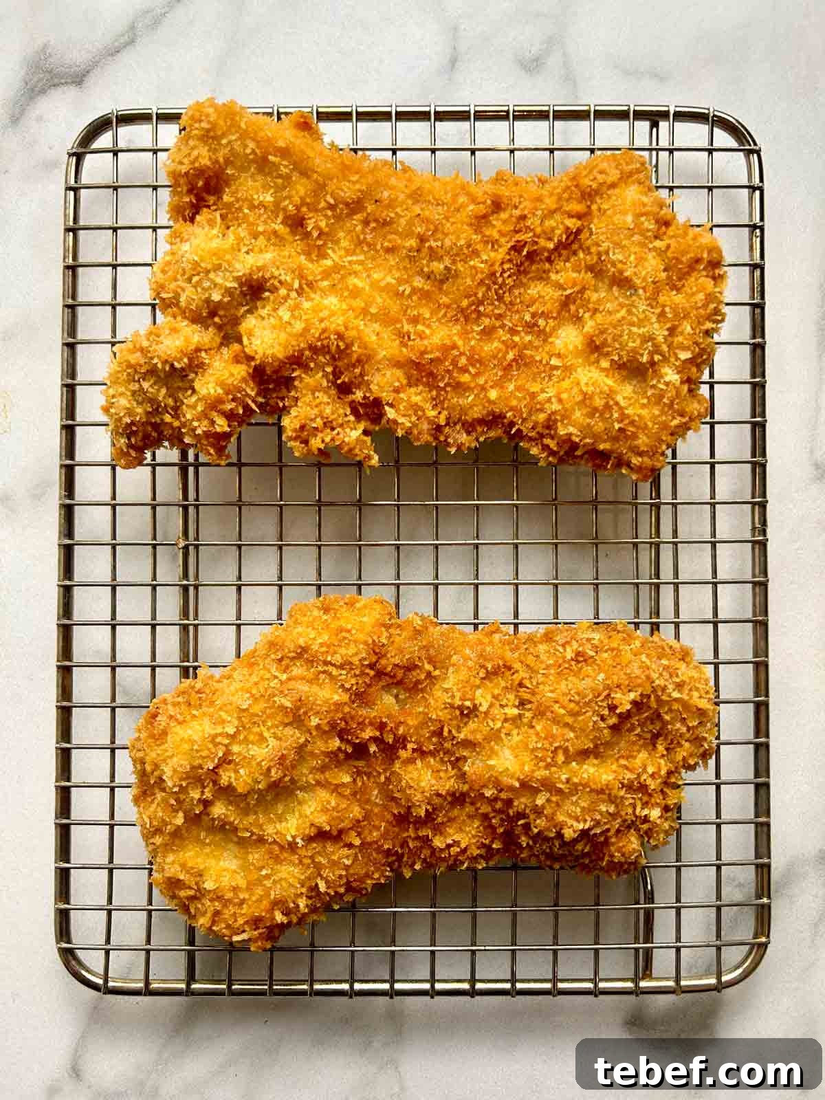 Chicken Katsu Musubi Recipe: How to Make Japanese Fried Chicken Rice Balls 11 cooked chicken katsu on wire rack