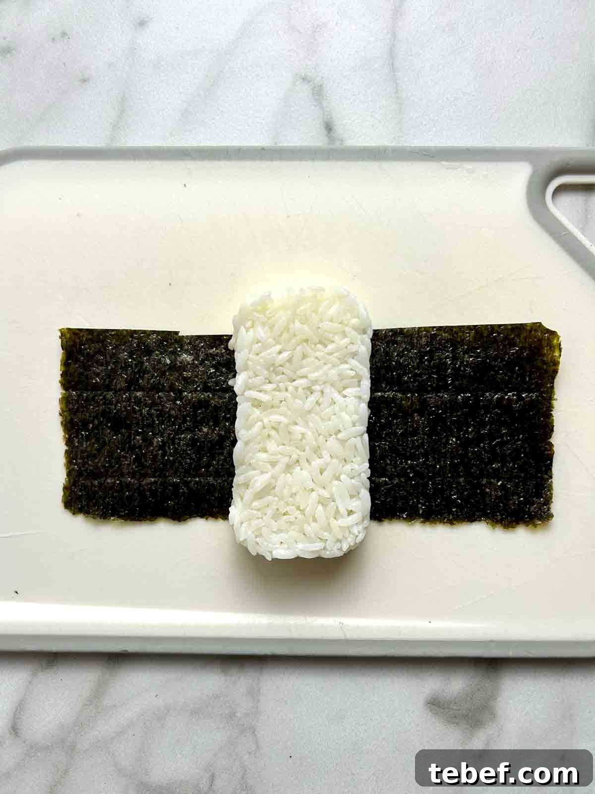 Chicken Katsu Musubi Recipe: How to Make Japanese Fried Chicken Rice Balls 12 rice shaped like rectangle on piece of nori