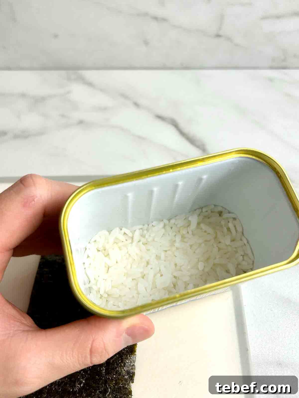 Chicken Katsu Musubi Recipe: How to Make Japanese Fried Chicken Rice Balls 3 hand holding Spam can with rice