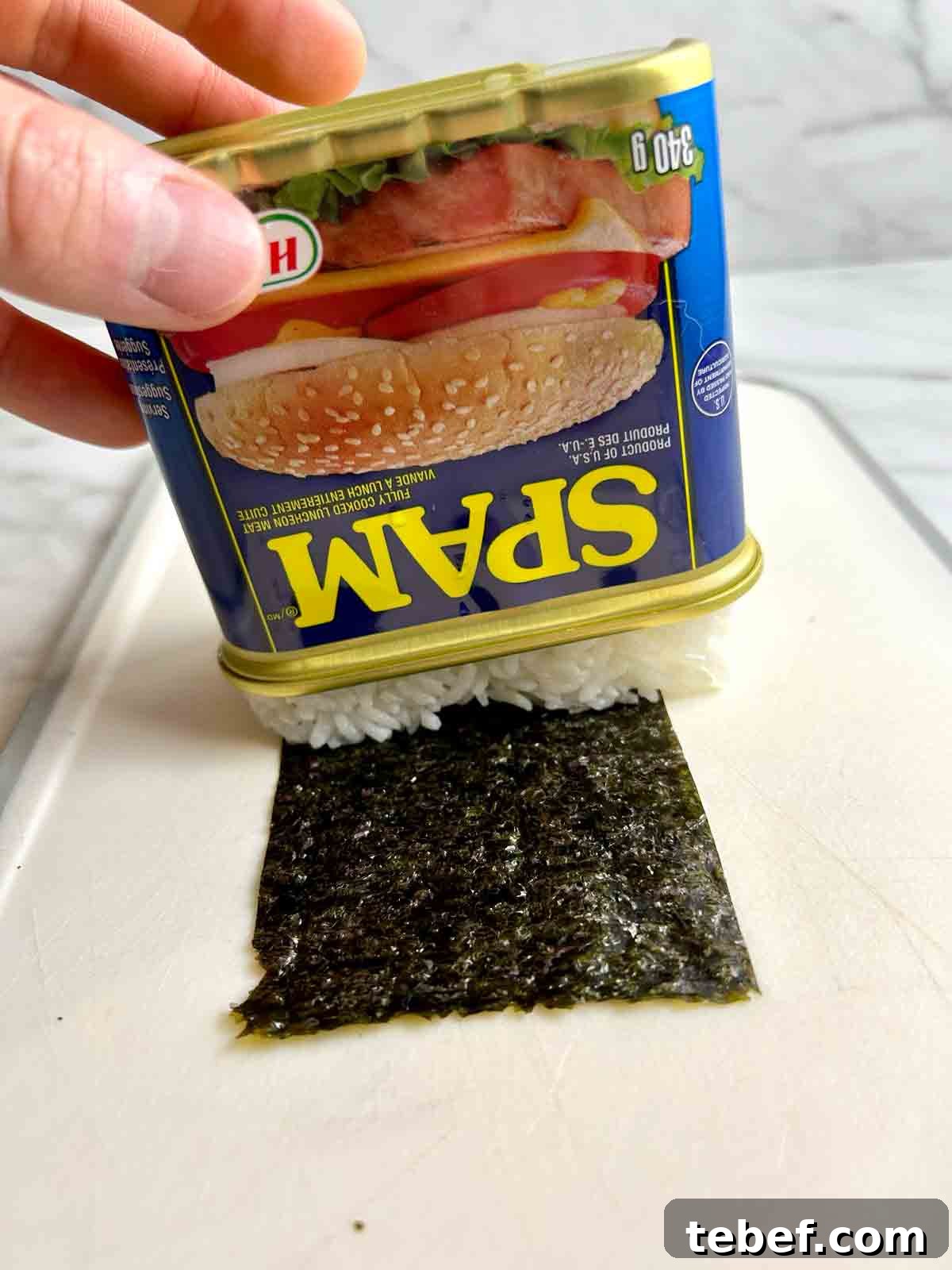 Chicken Katsu Musubi Recipe: How to Make Japanese Fried Chicken Rice Balls 4 rice being shaken from Spam can