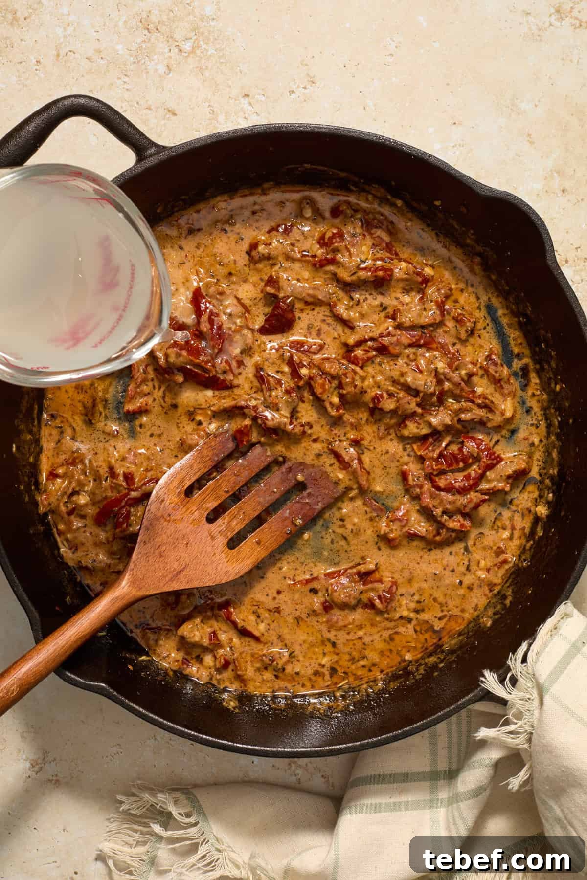 Sun-Dried Tomato Pasta with Savory Italian Sausage 9 Creamy sun-dried tomato sauce with pasta water being added in.