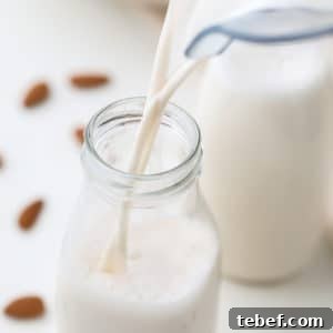 Almond Milk from Soaked Almonds: Quick Soak Method Guide 7 square image of milk pouring into glass