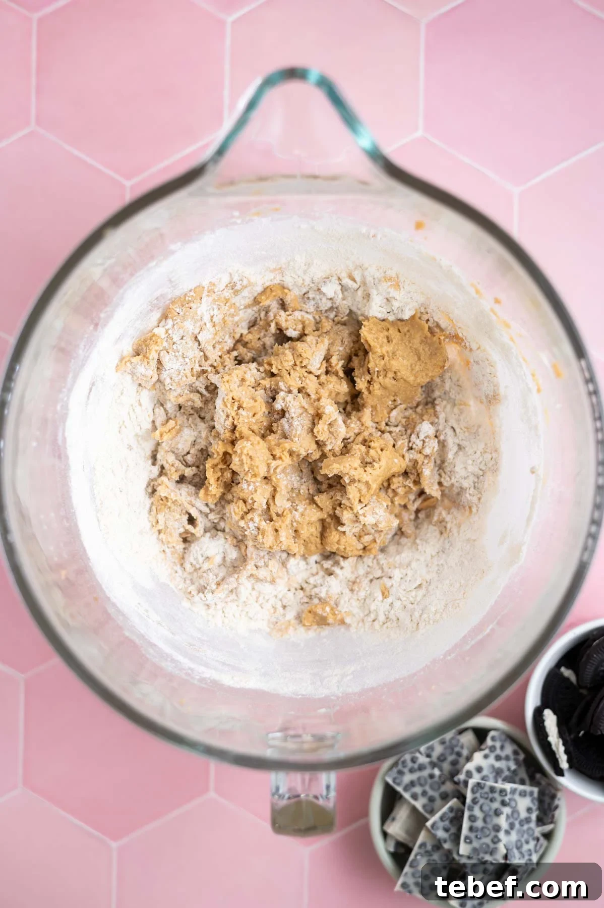 flour mostly mixed into cookie dough in a mixing bowl