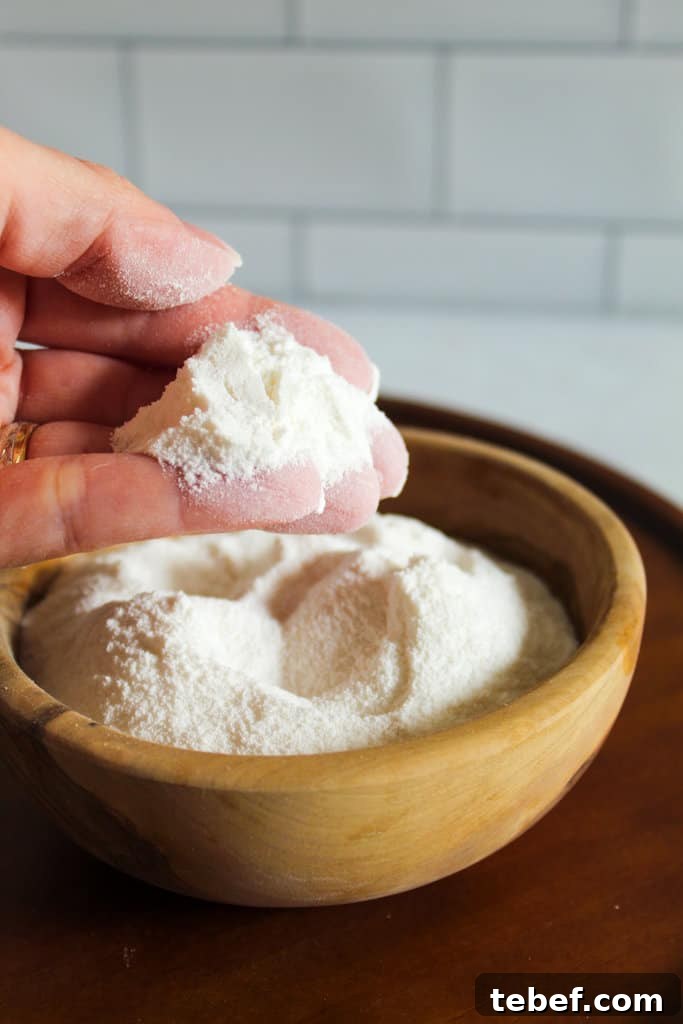 Almond Flour Substitutes: Top Alternatives and How to Use Them 7 brown bowl of sweet rice flour with a hand holding.
