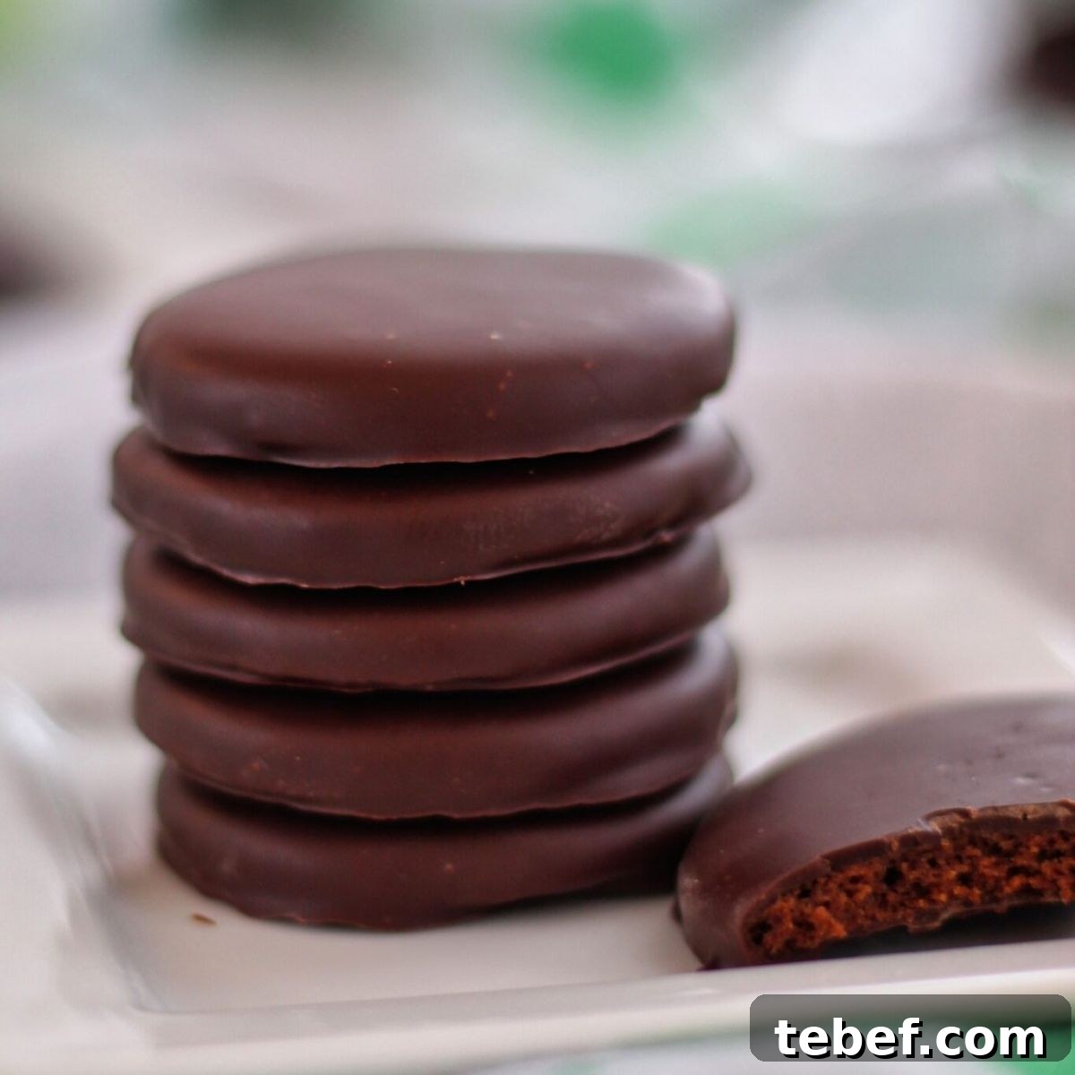 Gluten-Free Thin Mints: Girl Scout Cookie Copycat Recipe 2 stack of thin mints on white square plate with one broken in half.