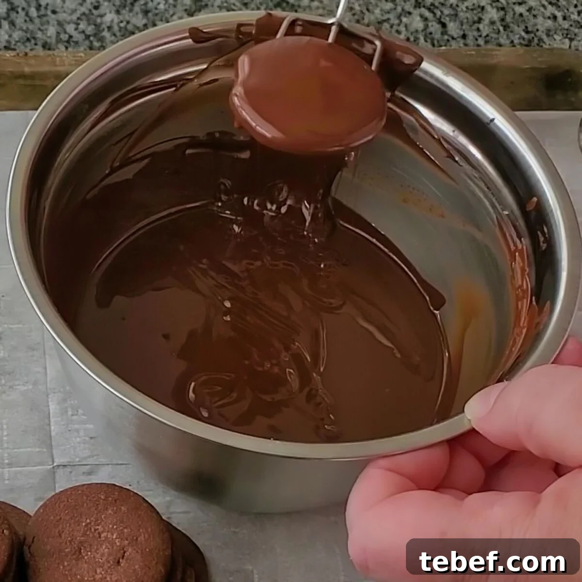 Gluten-Free Thin Mints: Girl Scout Cookie Copycat Recipe 11 dipping a cookie in melted chocolate.