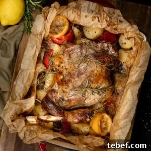 Greek kleftiko, leg of lamb lamb and potatoes in parchment paper. Slow roasted with red peppers and red onion.