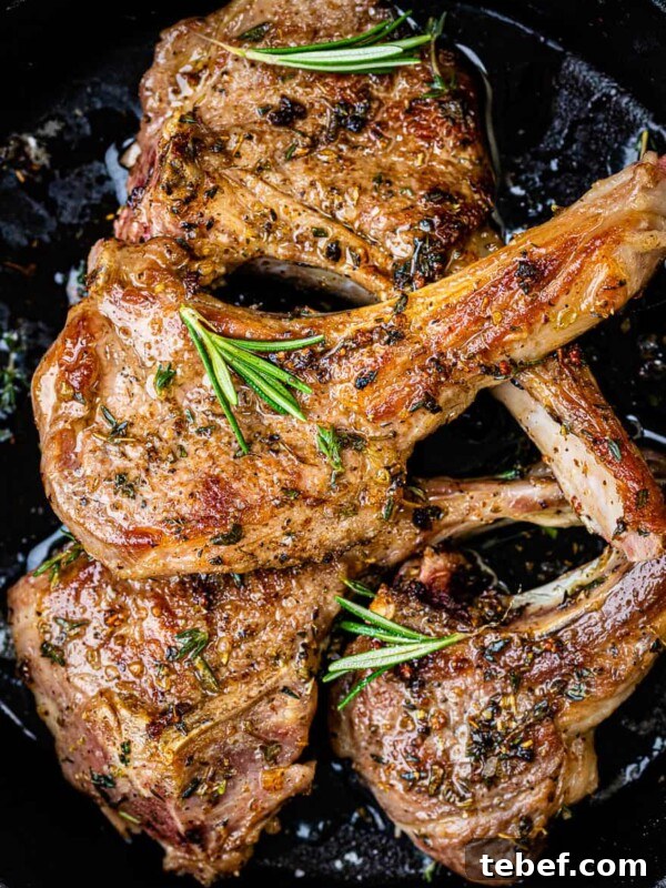 Three cooked lamb chops seasoned with herbs