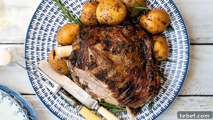 Leg of lamb on a platter with slice carved