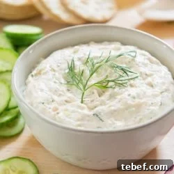 Creamy Smoked Salmon Spread Recipe for Bagels & Appetizers 7 Smoked Salmon Spread in Bowl with Dill, Cucumbers, Radish, and Crackers