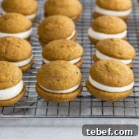 Mini Pumpkin Whoopie Pies with Cream Cheese Filling Recipe 9 mini pumpkin whoopie pies on a cooling rack