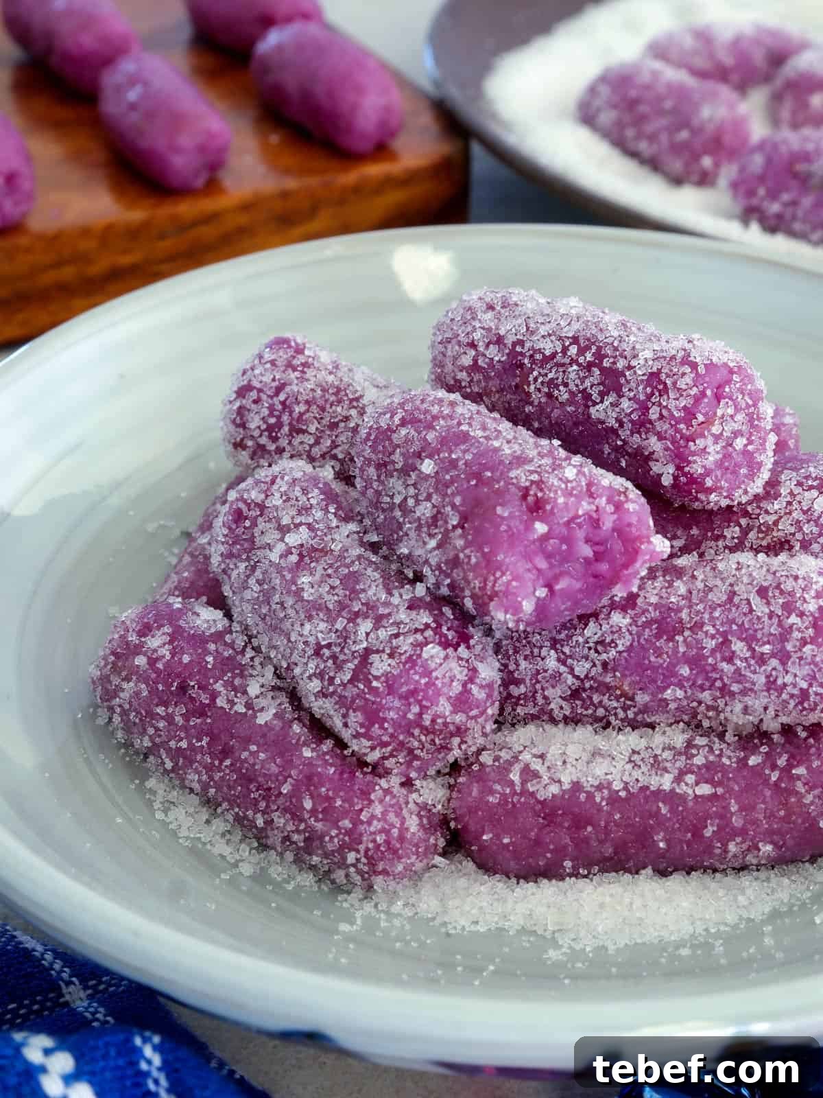 Ube Pastillas: Creamy Filipino Coconut Milk Candy Recipe 5 ube pastillas coasted with sugar on a plate