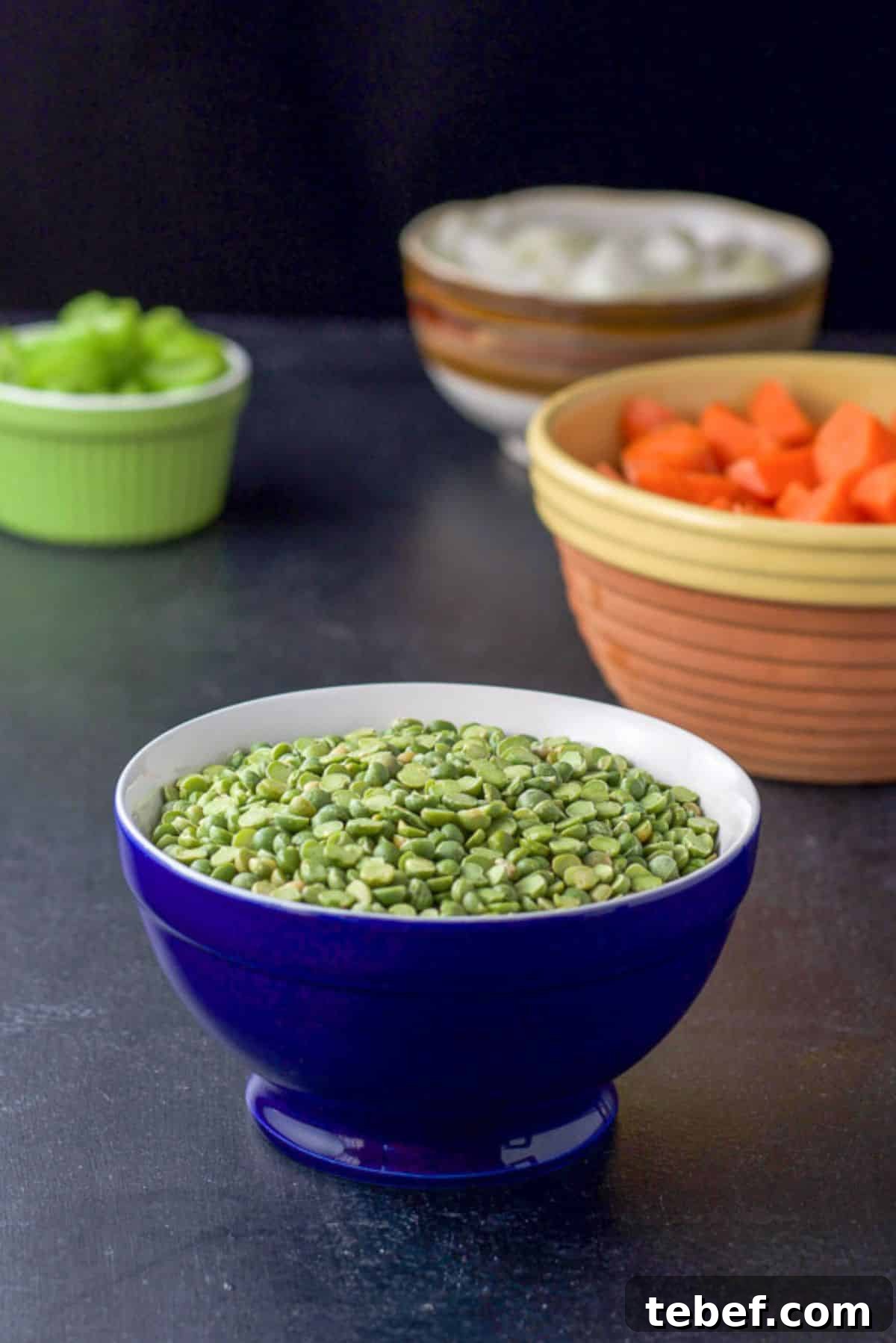 Instant Pot Split Pea Soup Recipe – Creamy, Hearty & Ready Fast 4 Split peas, carrots, onions, and celery in bowls on a black board