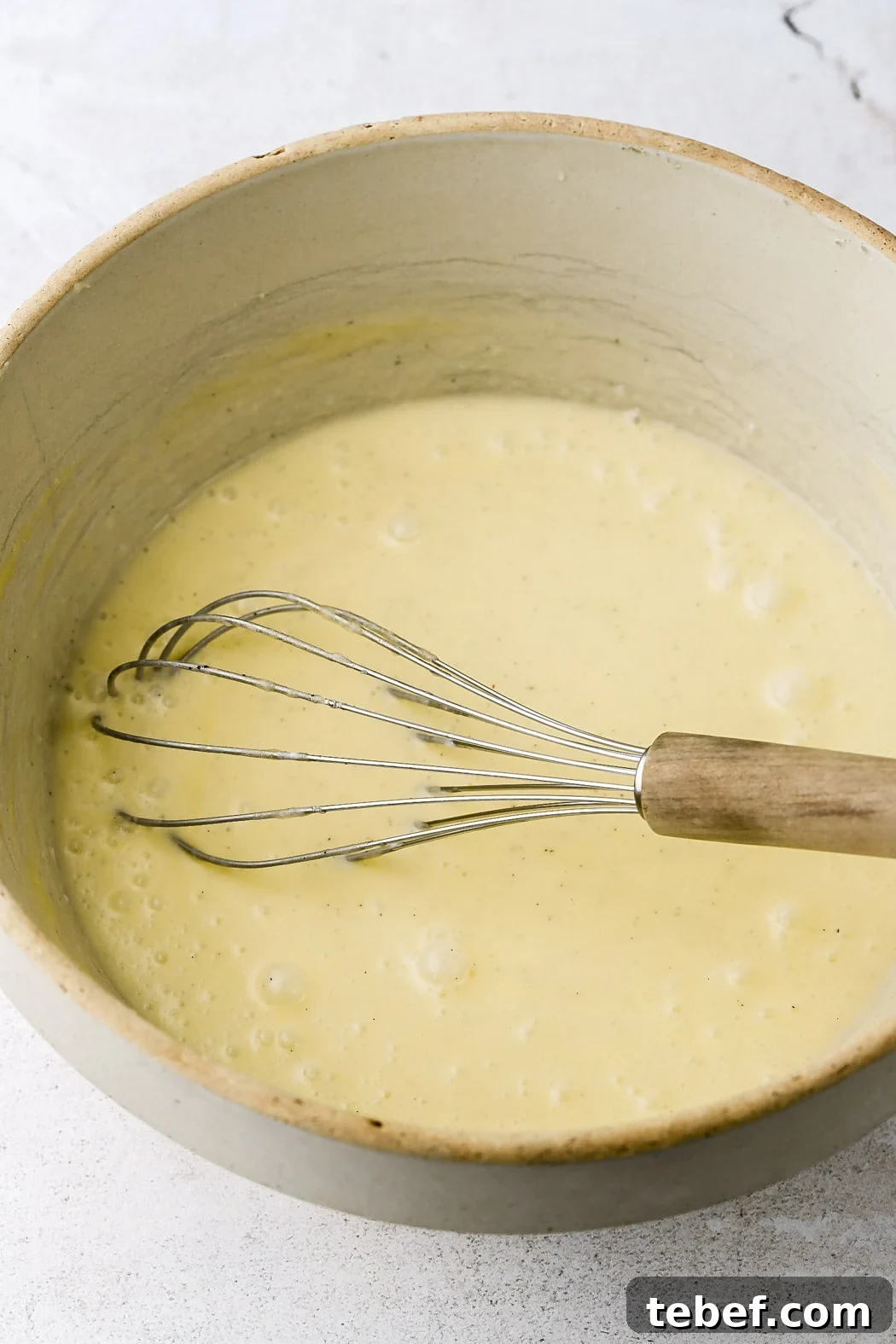 Bakery-Style Chocolate Chip Muffins Recipe That Delivers Flavor 5 whisk in greek yogurt and cream