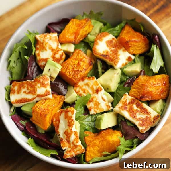 Roasted Pumpkin, Halloumi & Avocado Salad with Crispy Seeds 5 pumpkin, haloumi and avocado salad in a bowl