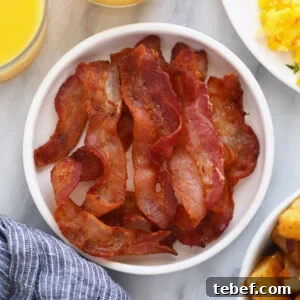 Sheet Pan Pancakes Recipe: Fluffy Oven-Baked Pancake Tray 7 bacon on plate