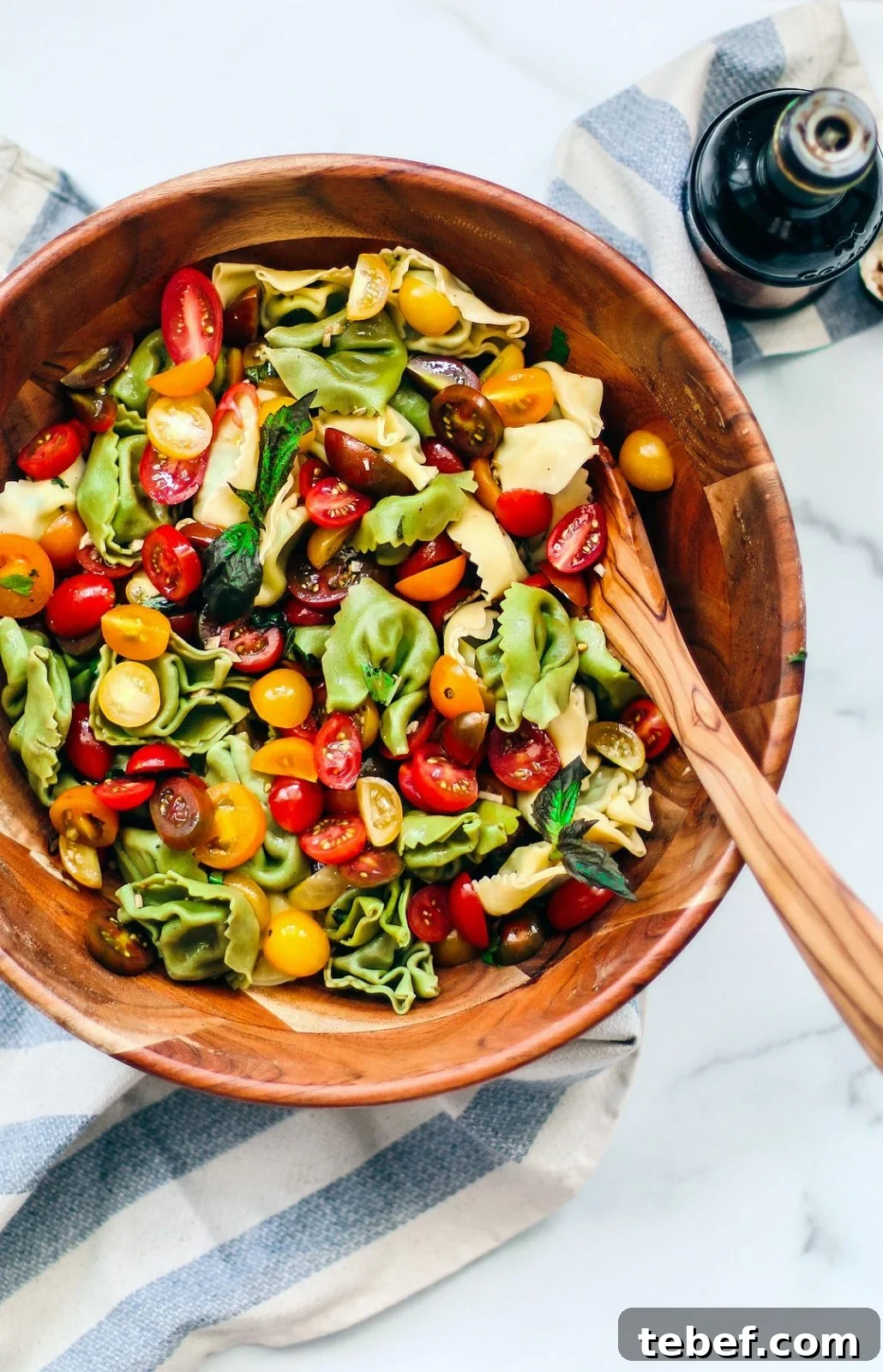 Bruschetta Tortellini Pasta Salad with Cherry Tomatoes & Basil 2 Big bowl of tortellini pasta salad.