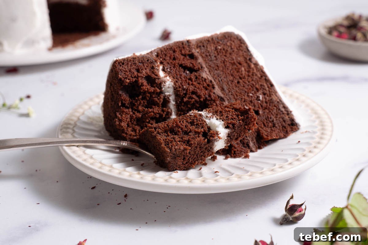 Chocolate Rose Cake with Vanilla Whipped Cream Recipe 8 Taking a bite out of a chocolate rose cake