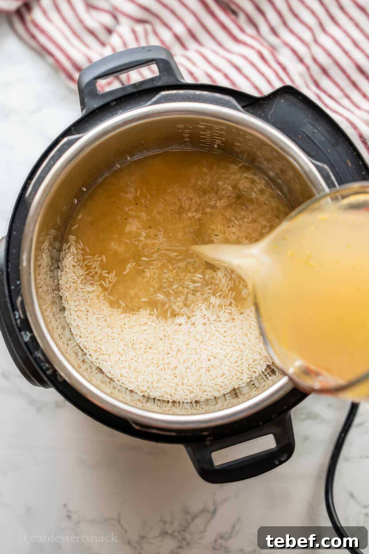 Perfect Instant Pot Jasmine Rice Recipe 4 Pouring broth into instant pot.