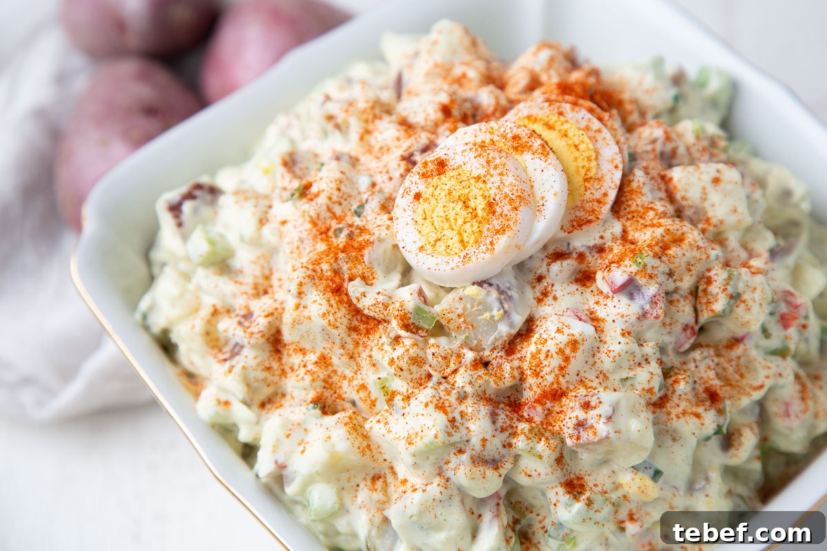 Creamy Red Potato Salad with Tangy Dill Dressing 6 red potato salad topped with paprika and hard boiled eggs.