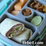 Ham and cheese wrap in bento box.