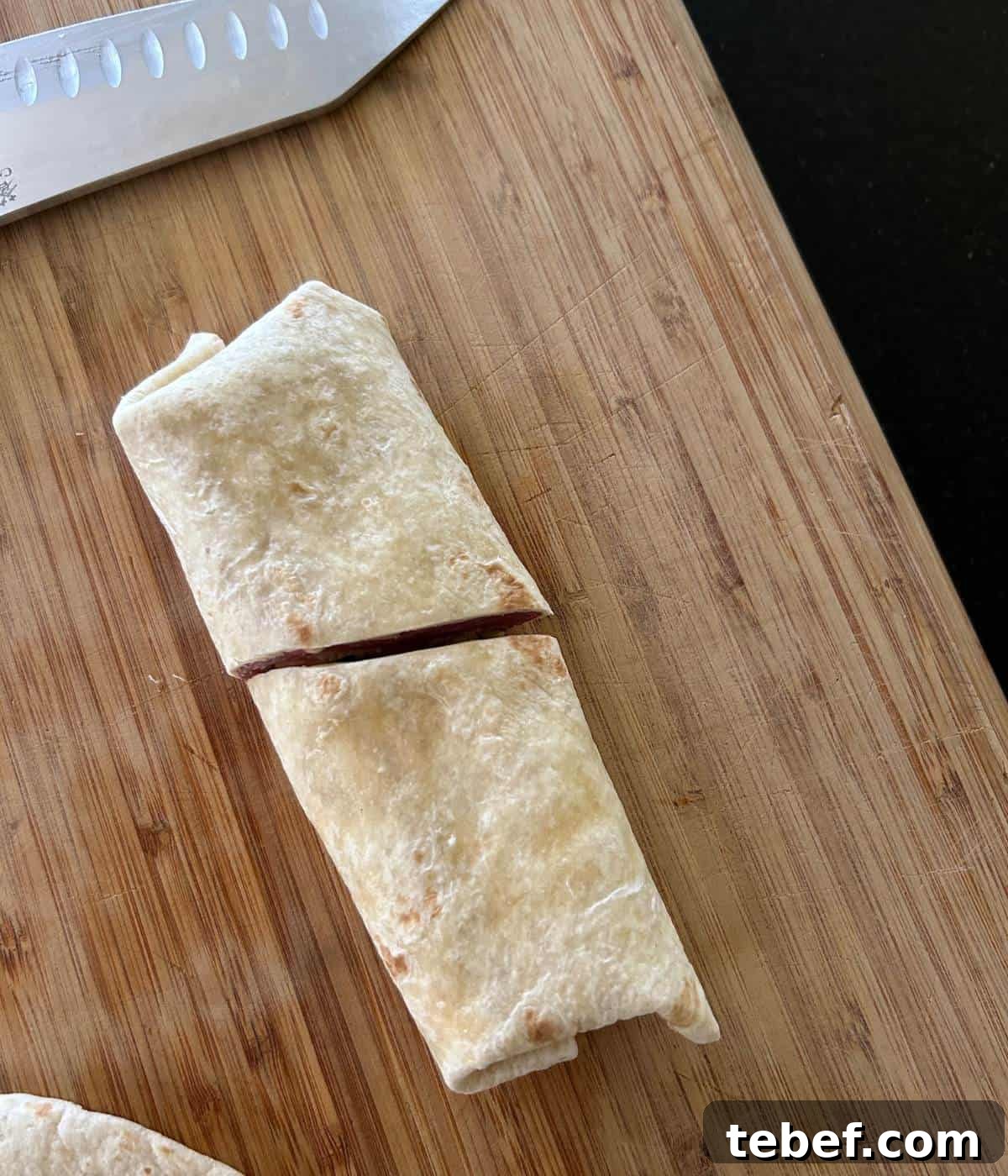 Classic Ham and Cheese Wrap Recipe for Quick Lunch or Snack 7 Wrap sliced in half.