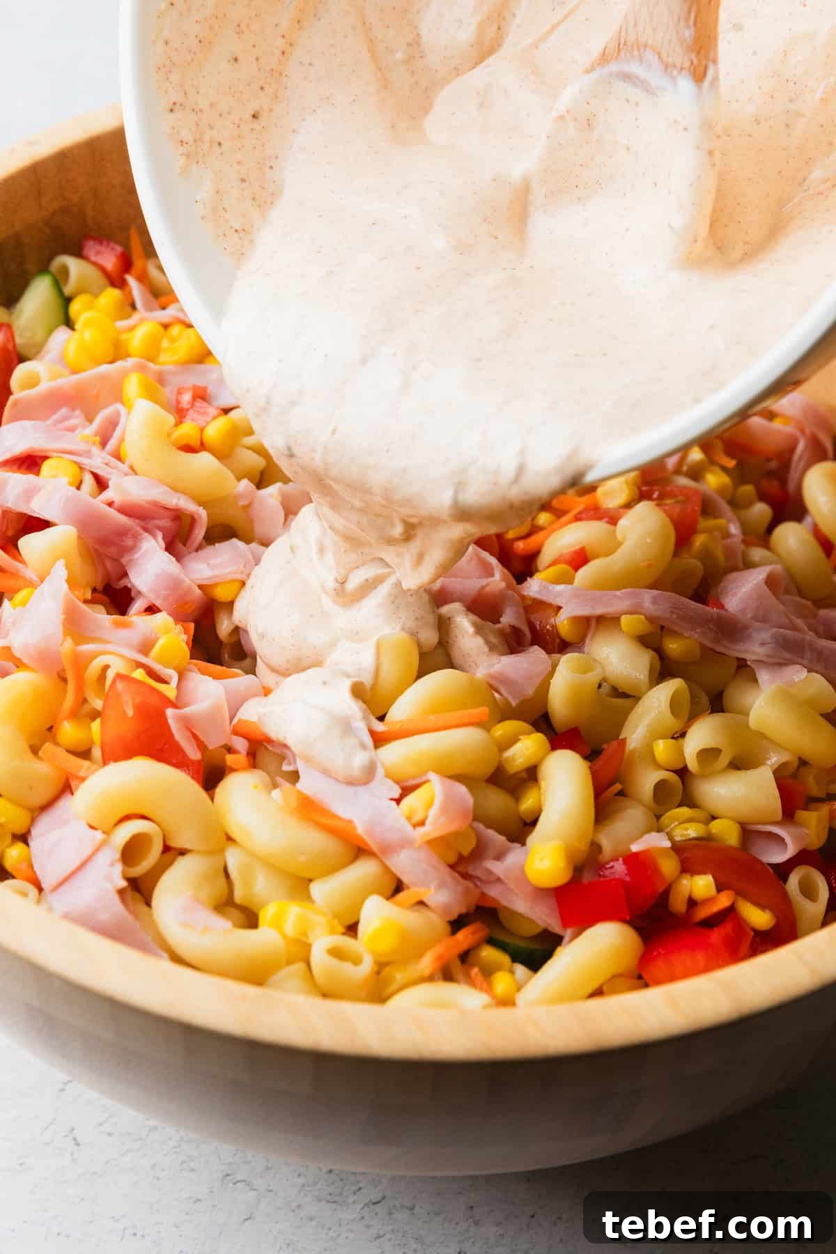 Mexican Macaroni Salad with Ham and Creamy Pepita Dressing 8 Pour chili lime dressing over the salad.