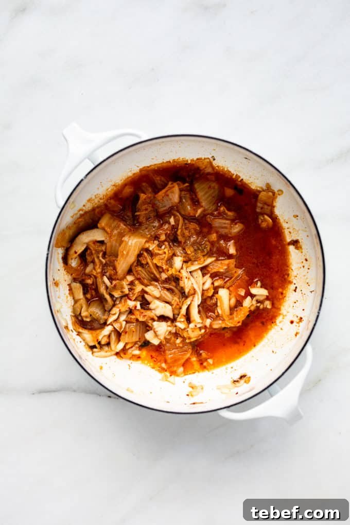 Authentic Kimchi Ramen Recipe: Spicy Korean Noodle Soup Guide 5 a white pot with kimchi in it