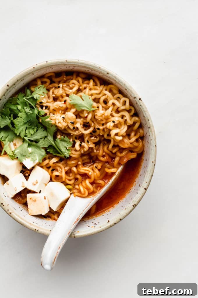 Authentic Kimchi Ramen Recipe: Spicy Korean Noodle Soup Guide 8 kimchi ramen in a bowl with noodles and tofu