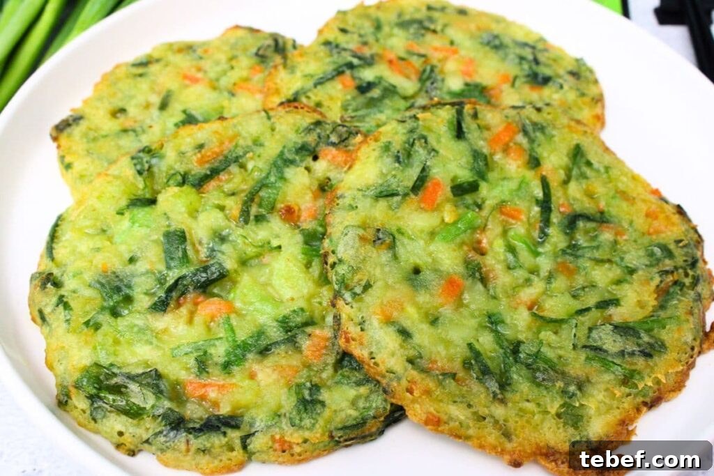air fryer trader joes scallion pancakes laying across a white plate