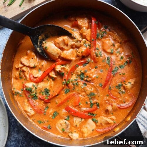 skillet with cooked Thai chicken curry