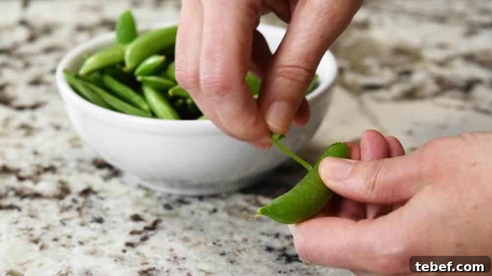 Crisp Sugar Snap Pea Salad with Lemon-Parmesan Dressing 6 Stringing a sugar snap pea