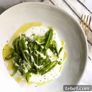 Crisp Sugar Snap Pea Salad with Lemon-Parmesan Dressing 10 Sugar Snap Pea Salad served in a white ceramic bowl