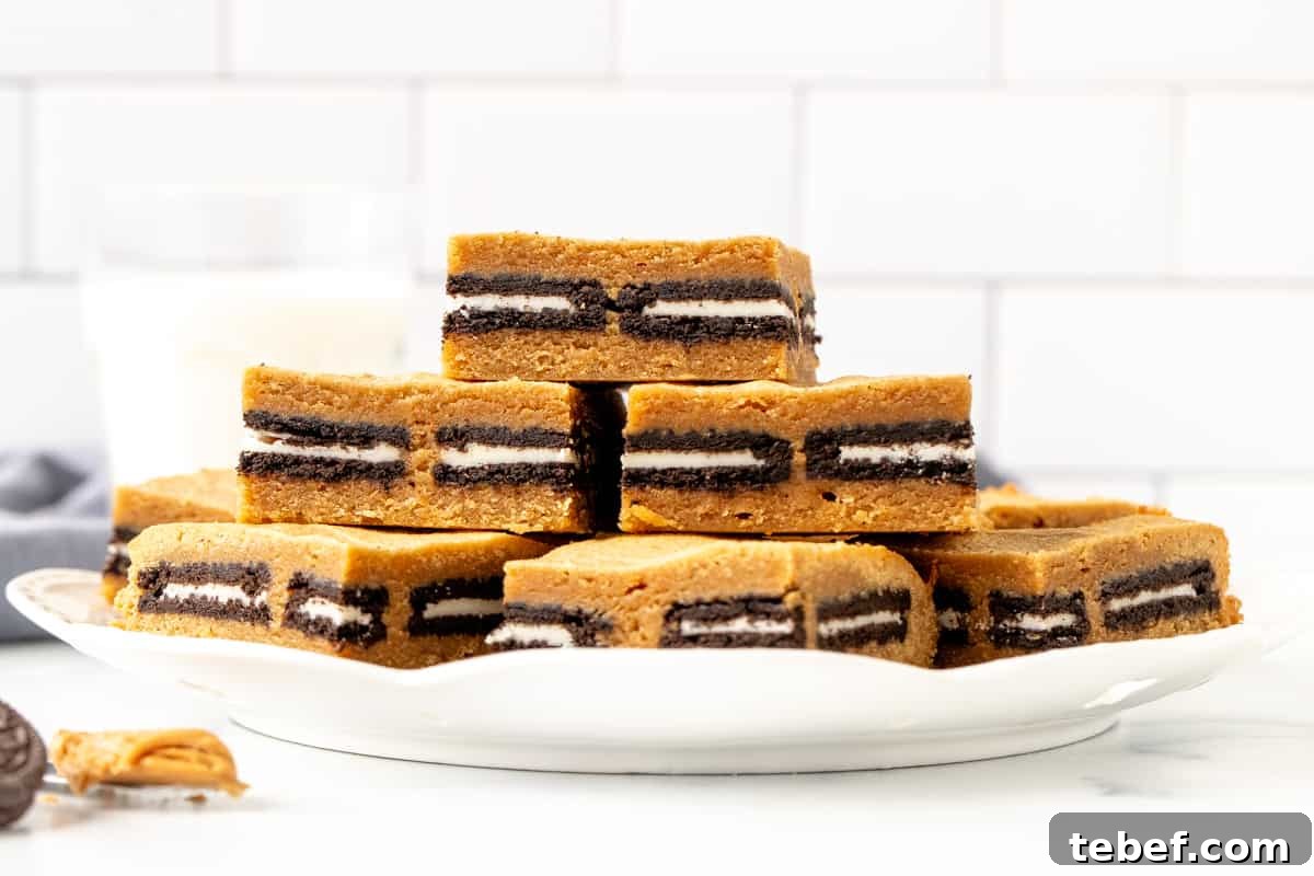 Peanut Butter Oreo Blondies Recipe — Gooey Cookie Bar Dessert 3 Plate of Oreo stuffed peanut butter blondies
