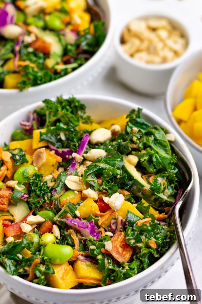 Thai Kale Salad with Creamy Peanut Dressing 10 Kale Thai salad in a serving bowl with an angled, closeup shot.
