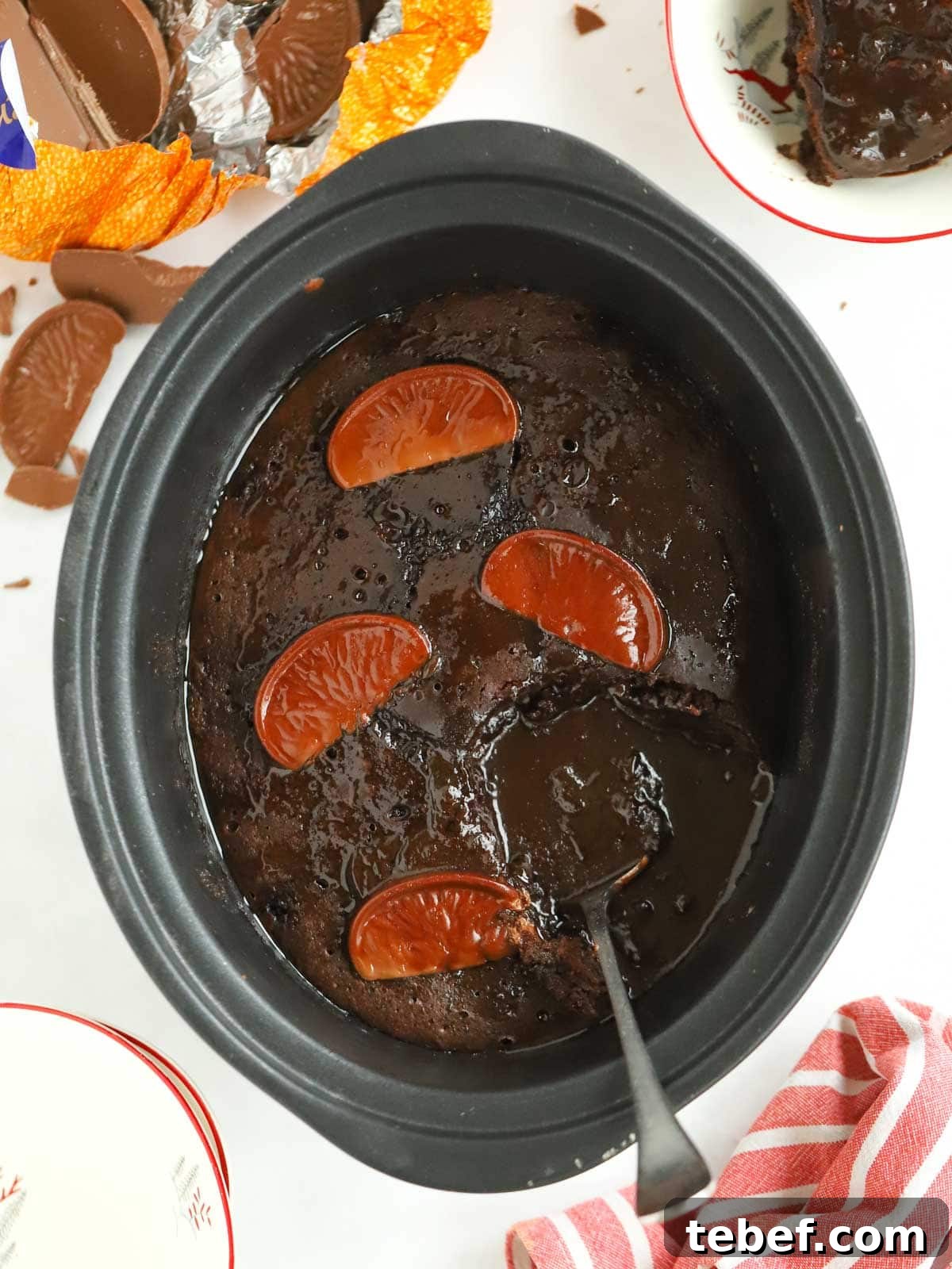 Slow Cooker Chocolate Orange Pudding Recipe 2 Slow cooker chocolate pudding with chocolate oranges, serving straight out of the pan.