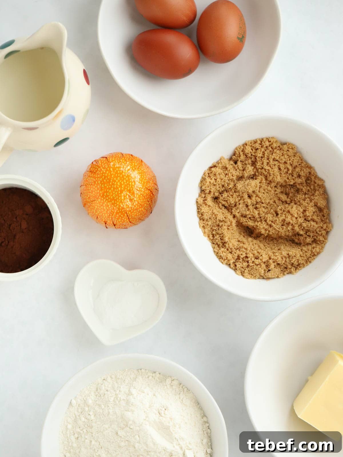Slow Cooker Chocolate Orange Pudding Recipe 5 Ingredients for Slow Cooker Chocolate Orange Pudding laid on a counter top.