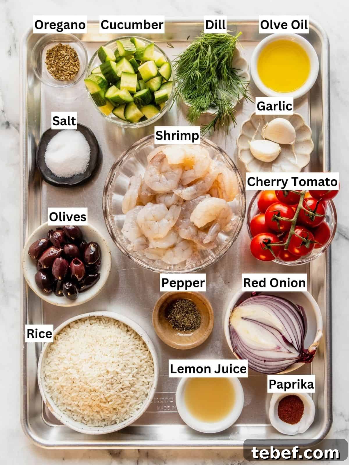 Mediterranean Shrimp Rice Bowl with Fresh Salad 4 Mediterranean shrimp rice bowl recipe ingredients with individual labels on a metal tray.